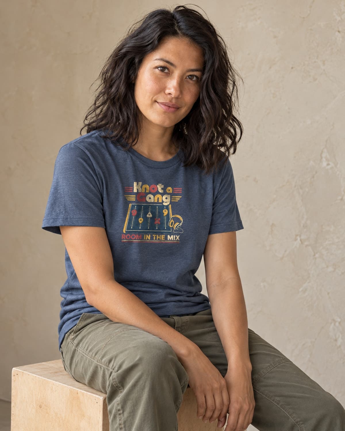A woman wearing the Indigo Room In The Mix T-shirt in natural studio light.