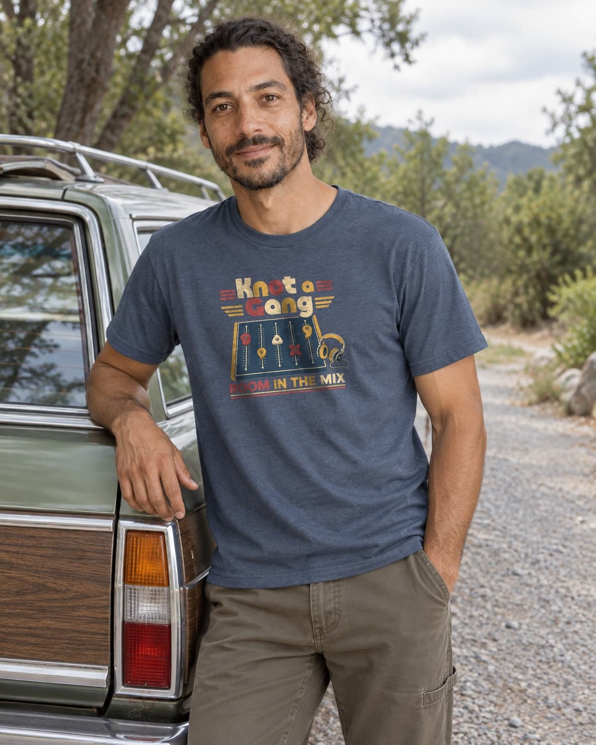 A man wearing the Indigo Room In The Mix T-shirt in a relaxed lifestyle setting.