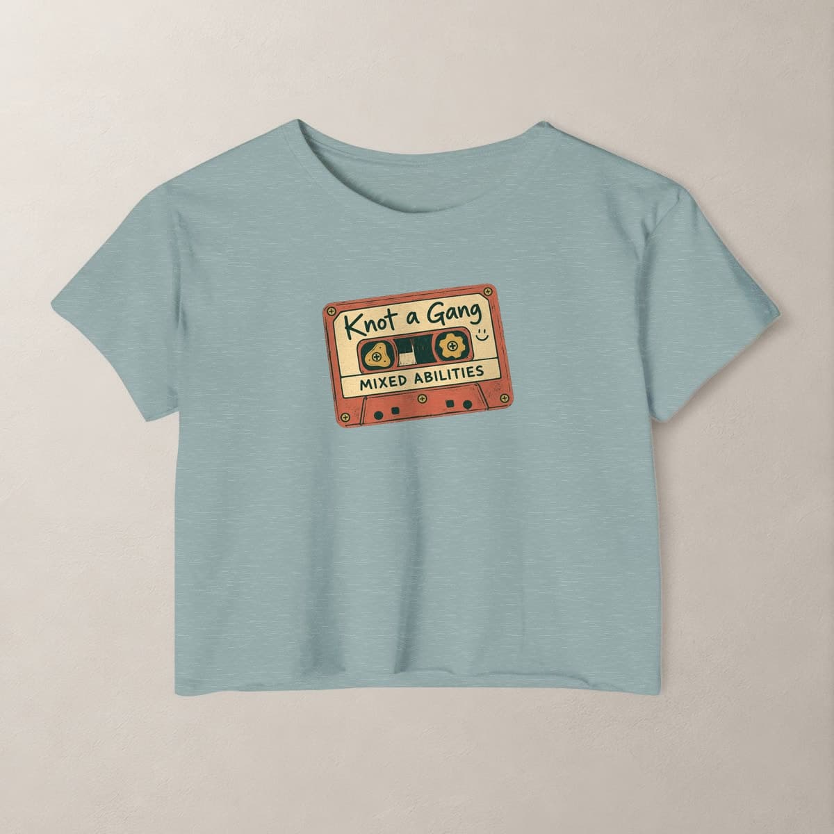 Front view of the Stonewash Green Mixed Abilities crop top.