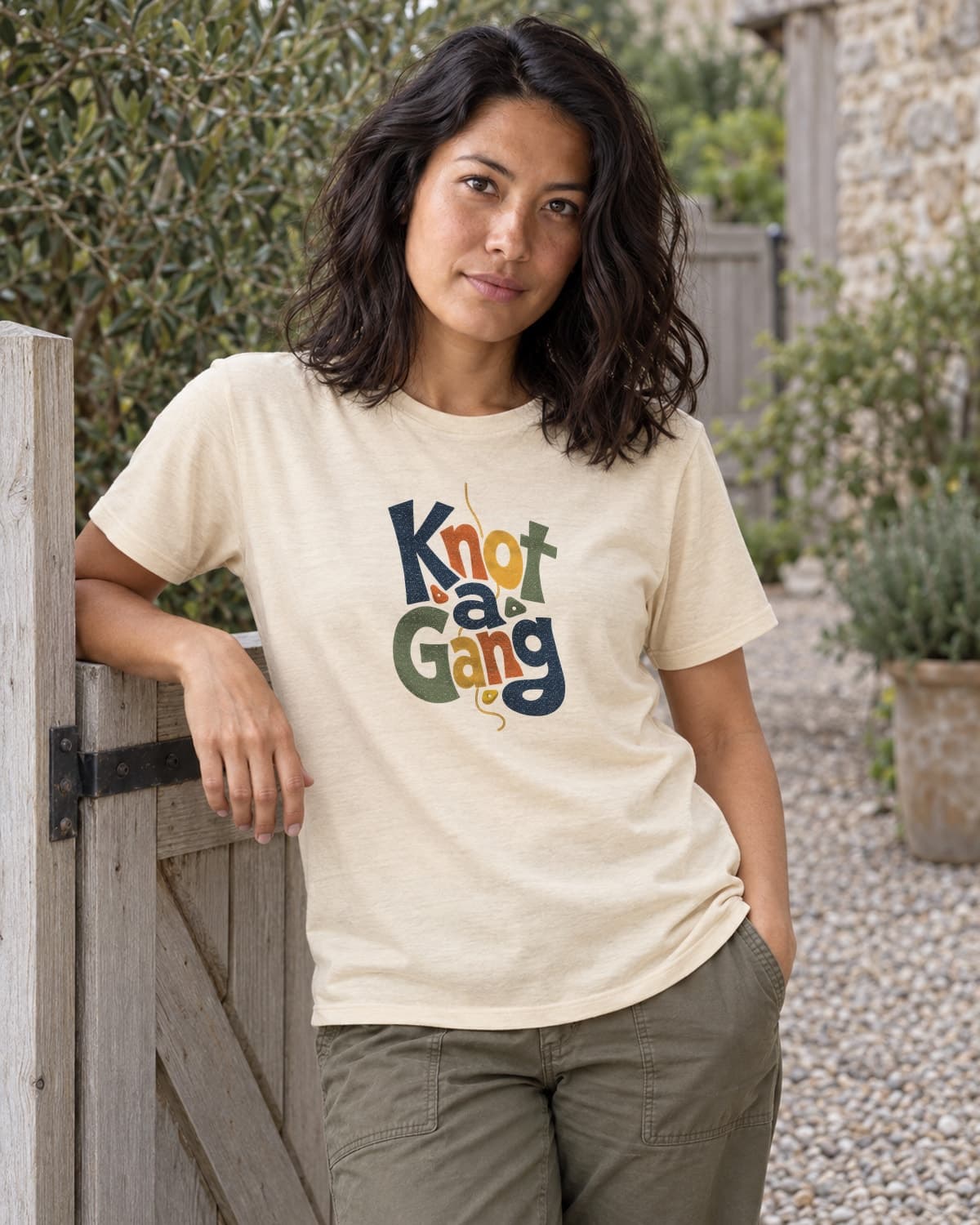 A woman wearing the Cream Type Can Lean T-shirt in a relaxed lifestyle setting.