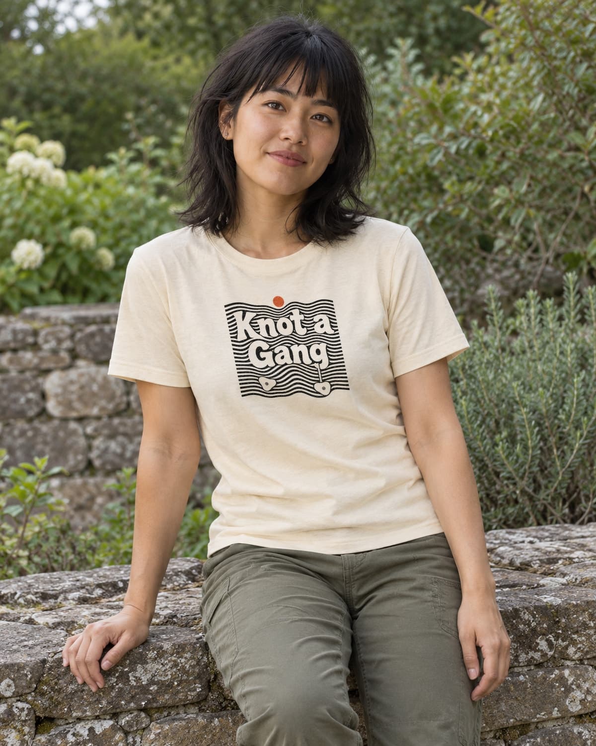 A woman wearing the Cream Double Take T-shirt in a relaxed lifestyle setting.