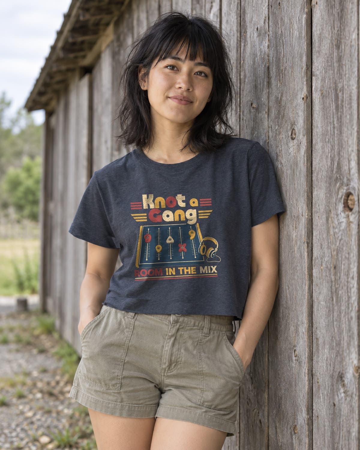A woman wearing the Antique Denim Room In The Mix crop top in a relaxed lifestyle setting.